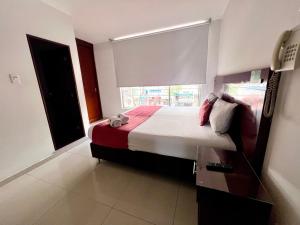 Postel nebo postele na pokoji v ubytování Hotel Dorado Gold