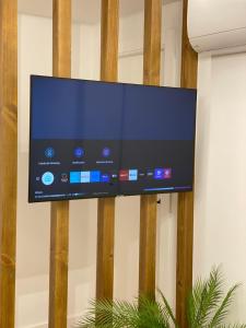 a flat screen tv hanging on a wall at LAR DE SEFA in Redondela