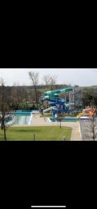 a water park with a water slide in a park at Chata Dominika in Dolná Strehová