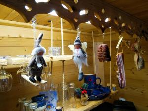 a group of stuffed animals hanging from a wall at Le refuge du poète in Saint-François-de-Sales