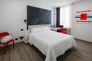 Postel nebo postele na pokoji v ubytování Crossroad Hotel