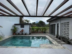 a swimming pool in the backyard of a house at Casas Plamont in Fortuna