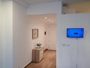 TV a/nebo společenská místnost v ubytování Blue Garden Apartment Punta Cana