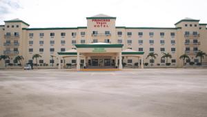 a hotel with a parking lot in front of it at Princess Vegas Hotel & Casino in Corozal