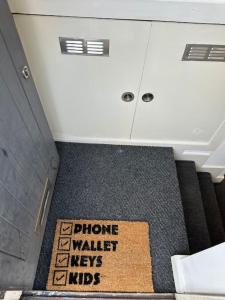 a picture of a bathroom with a sign on the floor at Opulent oasis in London in London