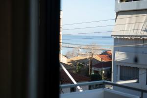 a view of the ocean from a balcony at Rincon De Luz in Kyparissia
