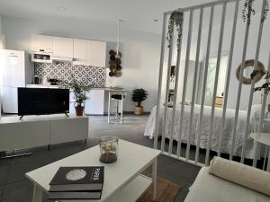 a living room with a kitchen and a room with a living room at Casa Gloria in Málaga