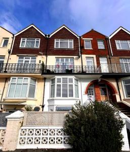 an apartment building with a balcony on top of it at Seaview 2 bedroom apartment in Littlehampton