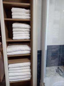 a towel rack in a bathroom with towels at Casa Pasiega in Renedo de Piélagos