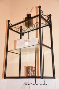 a glass shelf on a wall with a box at Agriturismo Poggio ai Legni in Sovicille