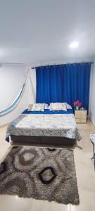 מיטה או מיטות בחדר ב-Hostal Confort Plaza