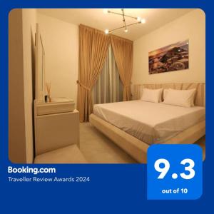 a hotel room with a bed and a window at Burj View 2BR Binghatti - Next to Marriot Hotel - Al Jaddaf in Dubai