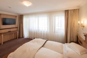 Voodi või voodid majutusasutuse Superior Hotel Post Ischgl toas