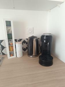 a coffee maker on a counter in a kitchen at La pause bretonne in Quéven