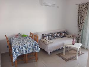 a living room with a couch and a table at Čalić in Seline