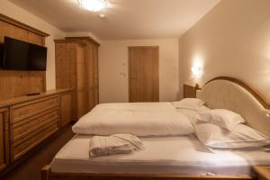 Voodi või voodid majutusasutuse Superior Hotel Post Ischgl toas