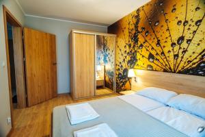 Posteľ alebo postele v izbe v ubytovaní Apartament 19 Szklarska Poręba