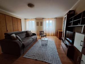 a living room with a couch and a table at Apartman Darija in Pazin