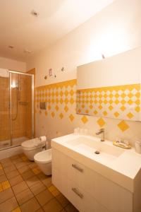 a bathroom with a sink and a toilet and a shower at Amalfi e Positano Home in Salerno +22 photos