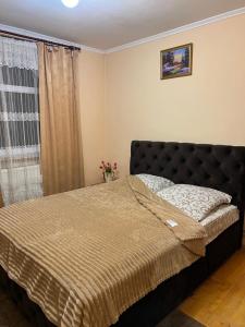 Postel nebo postele na pokoji v ubytování Cottage u Romana