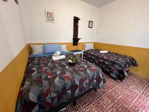 Un ou plusieurs lits dans un hébergement de l'établissement Casa del viajero Antigua