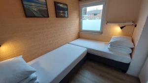 Postel nebo postele na pokoji v ubytování Vakantiehuis Ruby