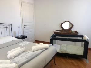 Кровать или кровати в номере Casa mia a Nervi