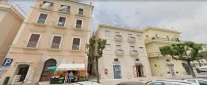 a group of buildings on a city street with cars at Di Schino House in Gaeta +3 photos