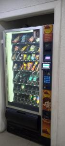a vending machine filled with lots of food and drinks at Apart Hotel Inga Providencia in Santiago