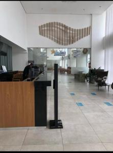 a lobby of a restaurant with a reception desk at BUGAN PAIVA RECIFE in Recife