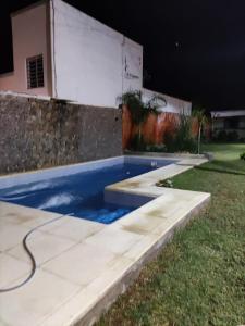 a swimming pool in front of a house at La Posada del Norte in La Rioja