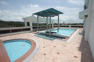 a swimming pool on the roof of a building at Parkview Hotel in Kampong Jerudong