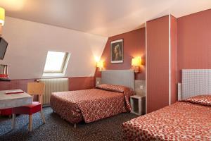 Un pat sau paturi într-o cameră la Hotel Miramar