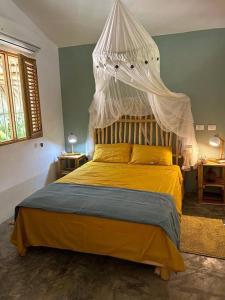 Postel nebo postele na pokoji v ubytování Casa Cayena