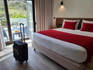 Postel nebo postele na pokoji v ubytování 3M Hostel & Suites