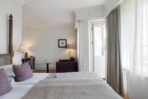 a hotel room with a bed and a window at Elite Park Avenue Hotel in Gothenburg