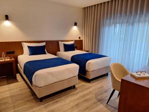 Postel nebo postele na pokoji v ubytování 3M Hostel & Suites
