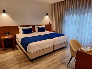 Postel nebo postele na pokoji v ubytování 3M Hostel & Suites