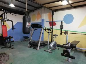 a gym with several exercise equipment in a room at El Remanso in Tonsupa