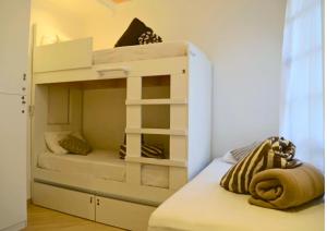 a bunk bed with two beds in a room at Villa Hostel in São Paulo