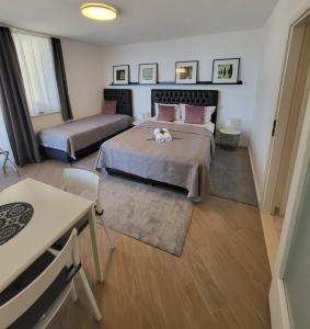 Postel nebo postele na pokoji v ubytování Blue Star Apartments