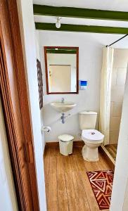 a bathroom with a toilet and a sink at Madre Tierra- Casa hospedaje in Villa de Leyva