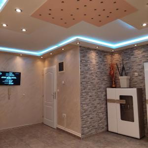 a room with a ceiling with a brick wall at Apartman Irena in Loznica