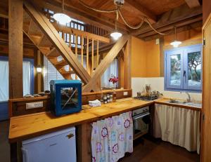 a kitchen with a counter with a blue box on it at LIMNI in Agios Nikolaos