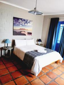 Posteľ alebo postele v izbe v ubytovaní Long Beach Cabanas