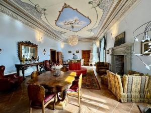 a living room with a table and a fireplace at Villa Dell'Annunziata in Rieti