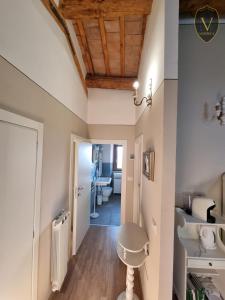 a hallway with white walls and a wooden ceiling at Vesionica Holiday House Perugia in Civitella Benazzone