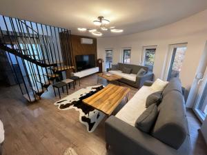 a living room with a couch and a table at Bellevue in Orllan