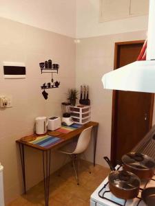 a kitchen with a table in the corner of a room at Buenos Aires Apartment in Buenos Aires