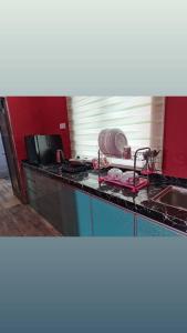 a kitchen counter with a mixer on top of it at VILLA HAJAH RUGAYAH BAKRI MUAR in Muar
